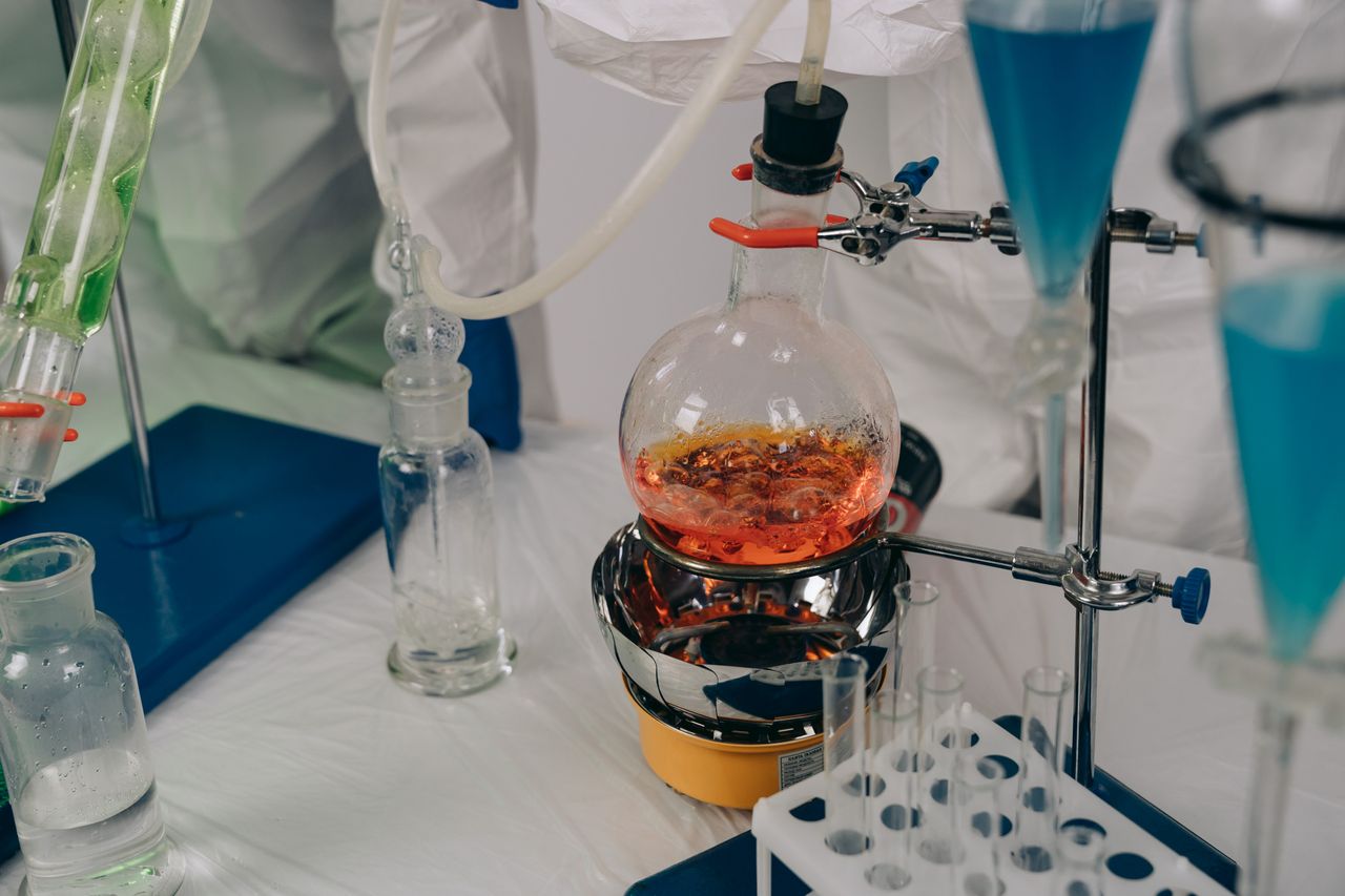 Menu Close-up of a chemistry experiment setup with laboratory equipment.